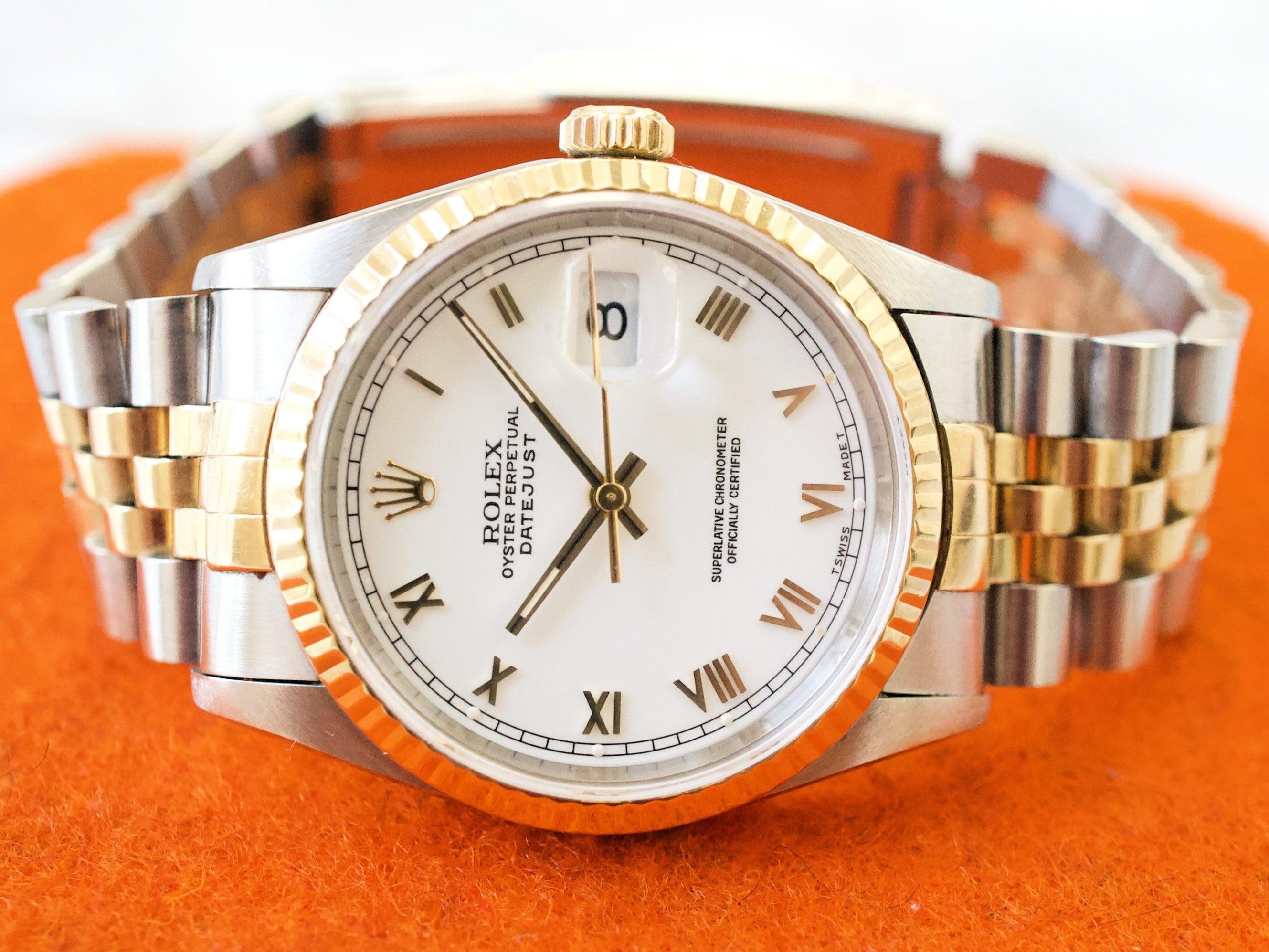 Two-tone gold and stainless steel automatic wristwatch with white dial and Roman numerals