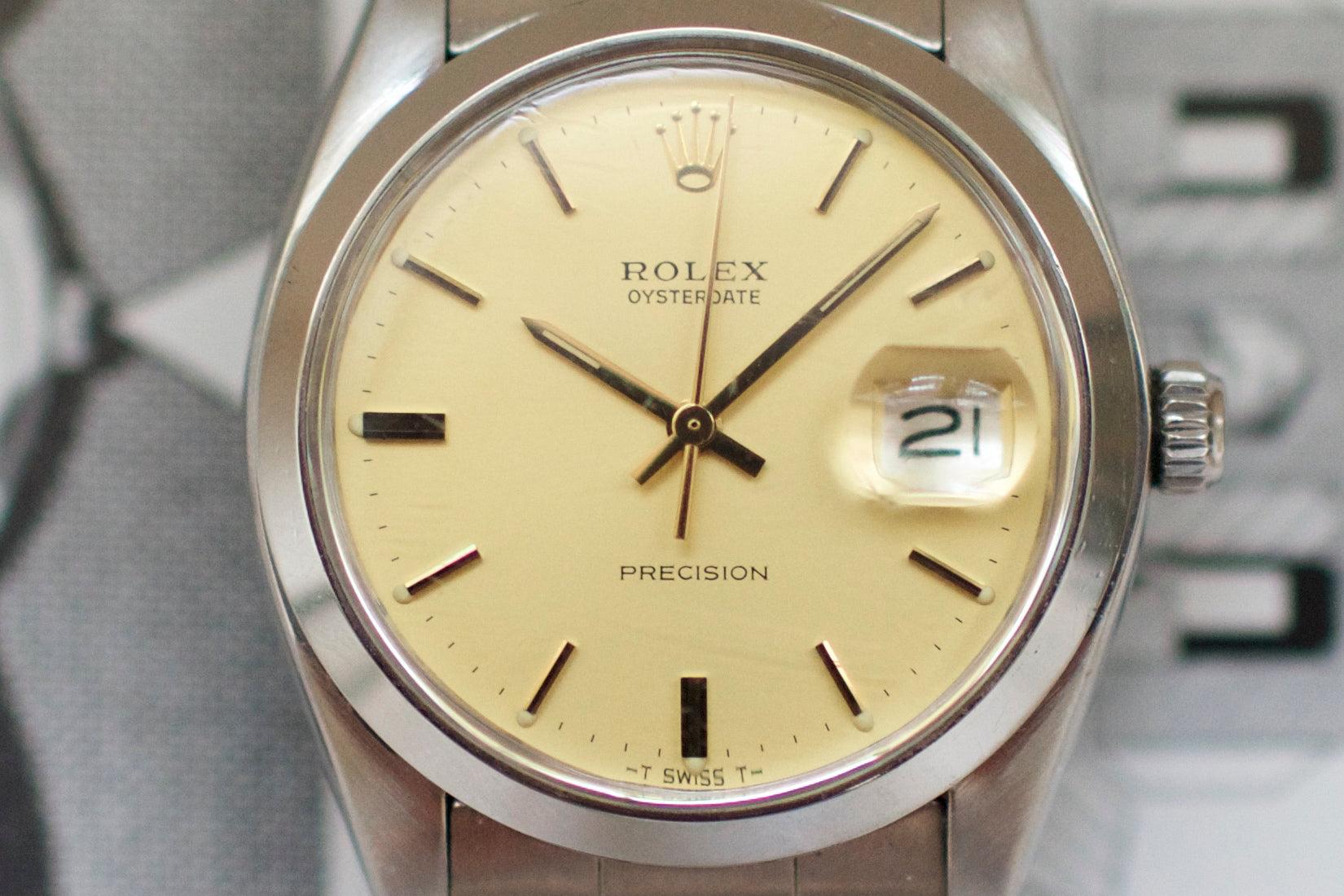 Close-up of luxury Swiss-made vintage Rolex Oysterdate watch with cream dial and date window