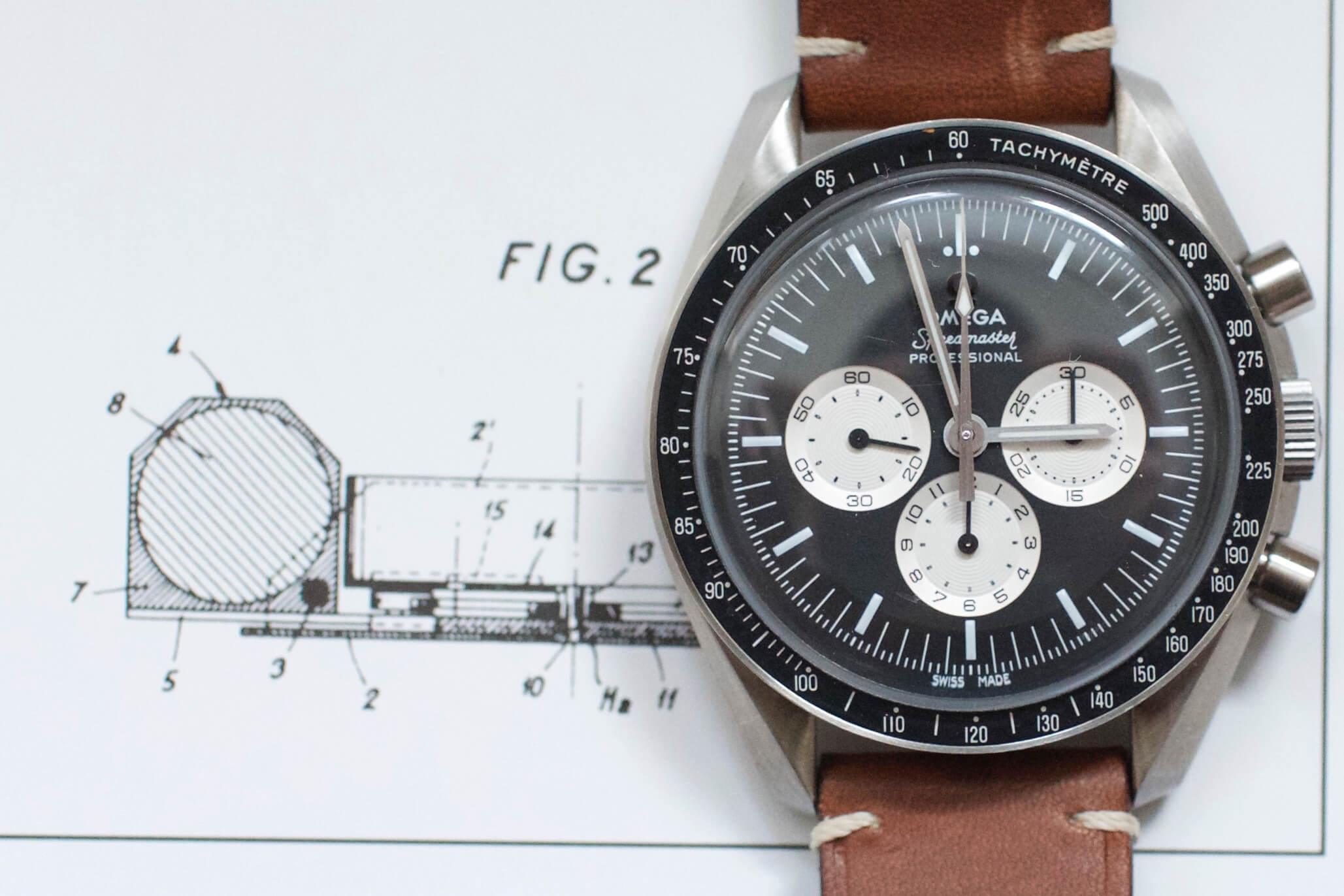 Omega Speedmaster Professional chronograph watch with brown leather strap on technical drawing background