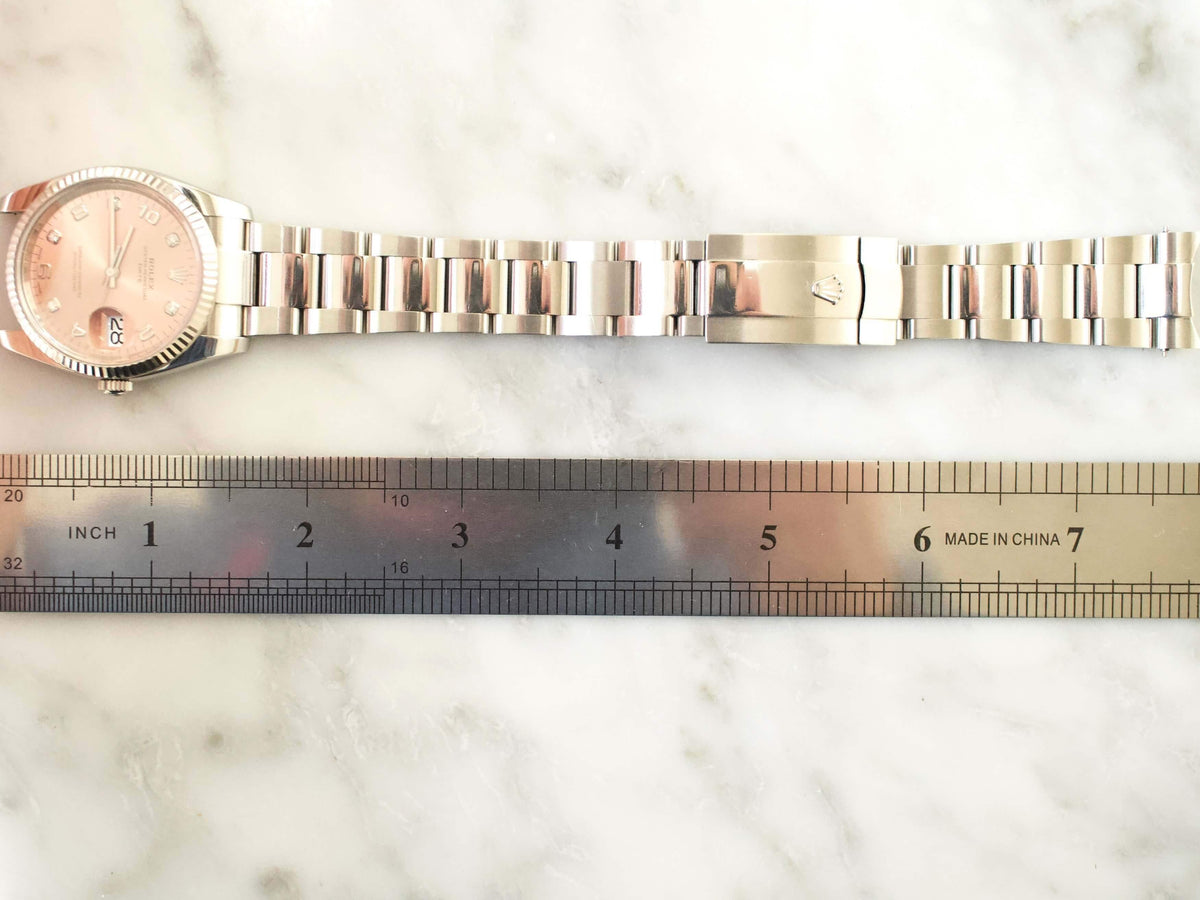 Rolex Oyster Perpetual Date 115234 34MM Factory Pink/Salmon Diamond Dial Factory Warranty Travel Box and Service Papers - WearingTime Luxury Watches