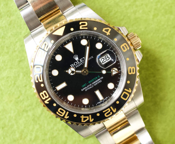 SOLDOUT: Rolex GMT Master II 116713LN CERAMIC Gold and Steel Automatic GMT Black Dial Box PAPERS