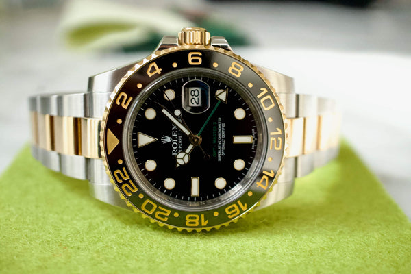 SOLDOUT: Rolex GMT Master II 116713LN CERAMIC Gold and Steel Automatic GMT Black Dial Box PAPERS