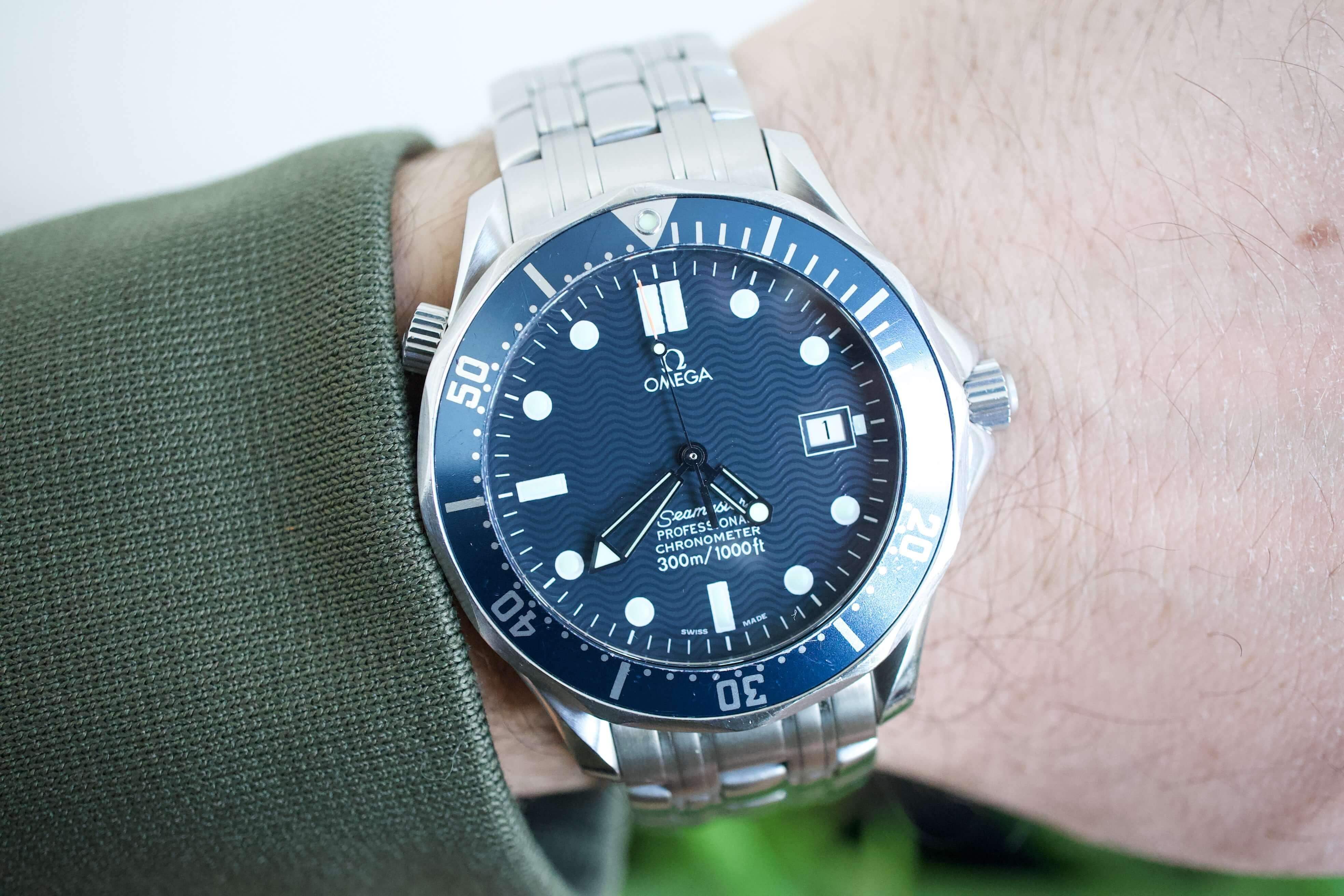 Omega Seamaster Diver 300M reference 2531.80 GoldenEye 1995 vintage blue dial close-up on leather surface moody studio light