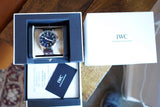 IWC Schaffhausen luxury watch in its original presentation box with warranty documents.
