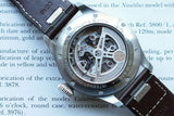 Close-up of the open case back of an IWC Big Pilot's Watch showing the automatic movement.