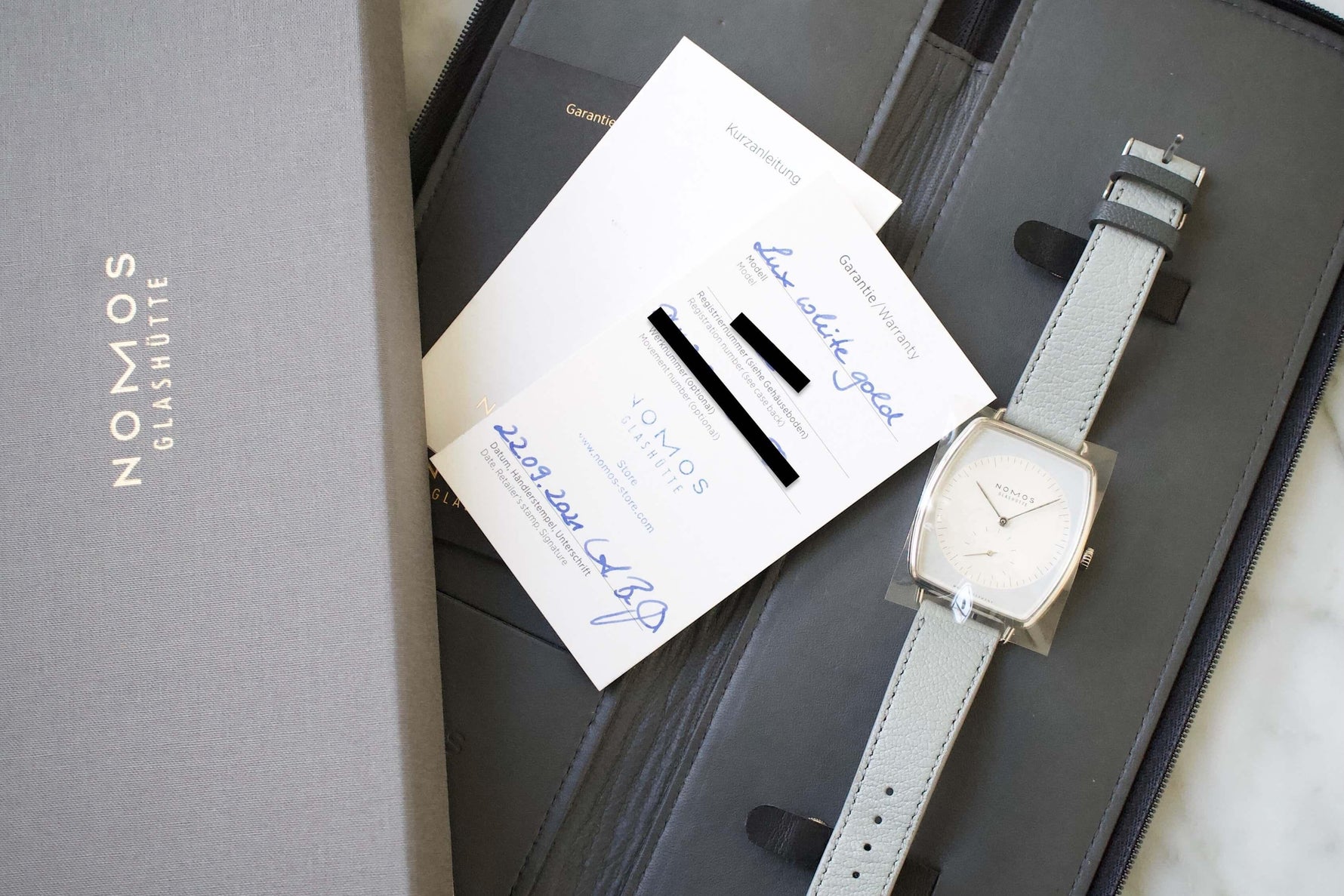 SOLD OUT: Nomos Lux Ref. 940 White Gold Blue Dial - WearingTime Luxury Watches