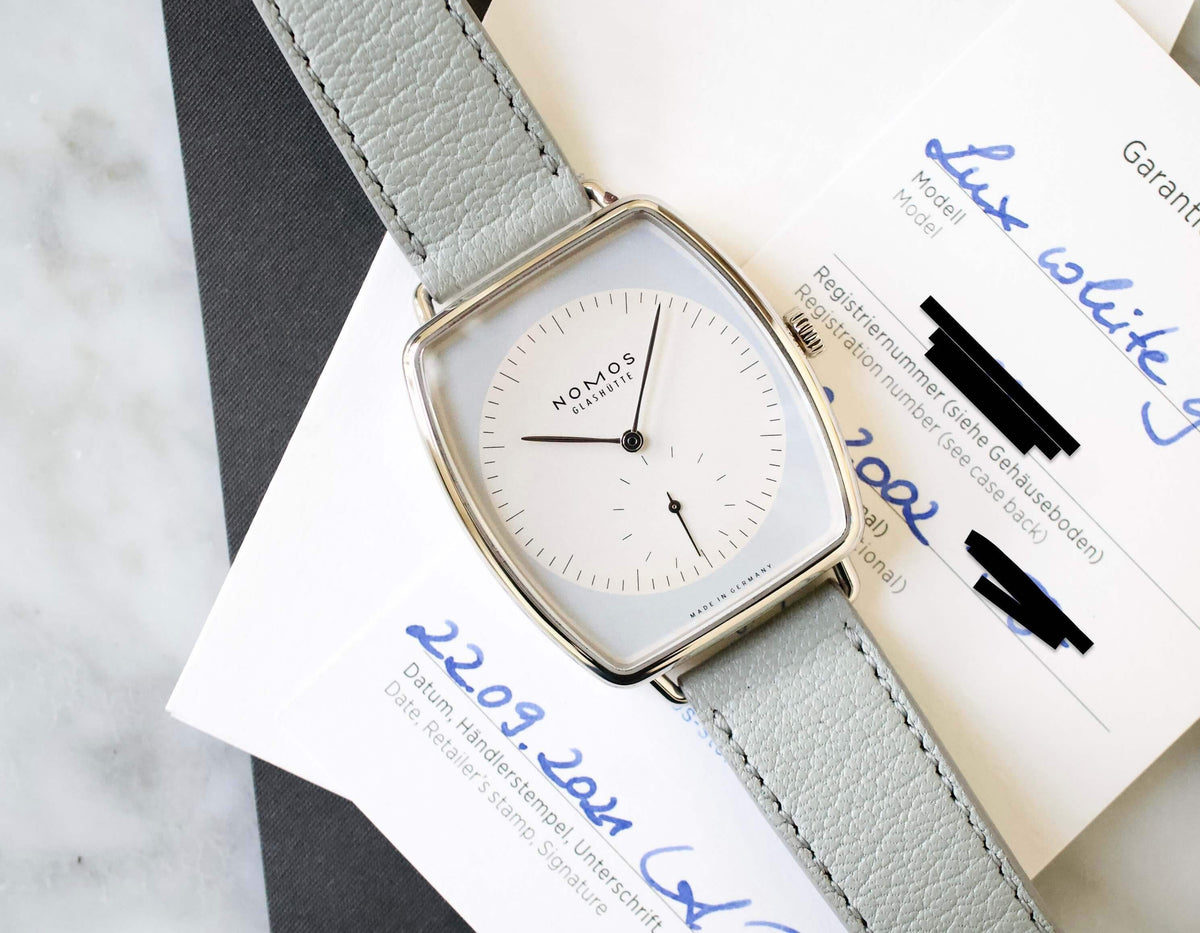 SOLD OUT: NOMOS LUX Ref. 942 TONNEAU 38.5 x 34mm White Gold Box Papers - WearingTime Luxury Watches