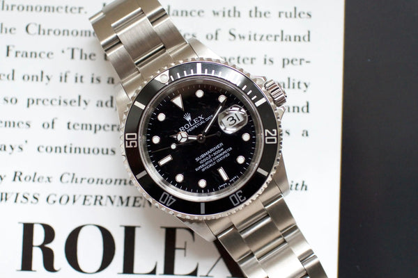 2006 Rolex Submariner 16610 stainless steel luxury dive watch with black dial and date display