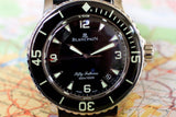 Blancpain Fifty Fathoms black dial diver watch with luminous markers and bezel