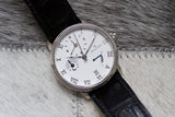Elegant Swiss-made luxury wristwatch with white dial, Roman numerals, black leather strap