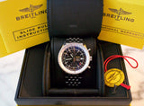 Stainless steel luxury chronograph watch with black dial in original box, warranty and tags visible