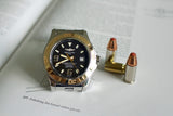 Breitling Superocean 44mm luxury watch with black dial on open book, next to three bullets