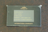 Breitling Superocean 44mm international warranty card on granite surface