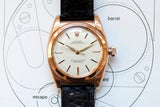 Vintage rose gold Oyster Perpetual watch with cream dial and black leather strap
