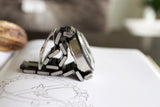 Stainless steel chronograph watch with metal bracelet on technical drawing background
