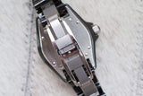 Close-up of a Swiss-made stainless steel women's luxury watch clasp and caseback