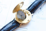 Vintage Ebel gold pocket watch with a blue leather strap on a technical drawing.