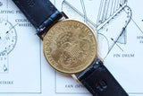Gold United States Twenty Dollar coin converted into a luxury watch with a black leather strap