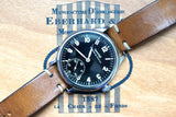Vintage Eberhard & Co. Swiss watch with a black dial and brown leather strap.