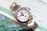 Rolex Oyster Perpetual Date luxury watch with silver dial and steel bracelet on document