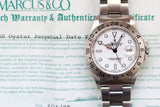 Rolex Oyster Perpetual Date Explorer II luxury watch resting on its original warranty certificate