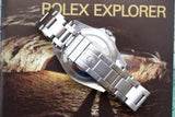 Close-up of a Rolex Explorer luxury watch with a stainless steel bracelet