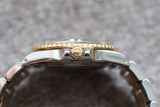 Close-up profile view of a luxury two-tone gold and steel watch with a fluted bezel.