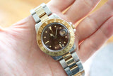 Rolex GMT-Master II luxury watch with two-tone gold and steel bracelet and brown bezel