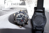 Heuer Bund SG 1550 flyback chronograph with black dial and black leather strap on display