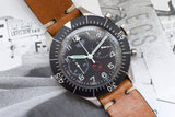 Vintage Heuer Bund SG 1550 flyback chronograph watch with black dial and brown leather strap