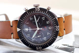 Heuer Bund SG 1550 vintage flyback chronograph watch with black dial and tan leather strap