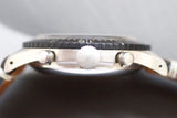 Close-up of a Swiss-made luxury chronograph watch side case with crown and pushers