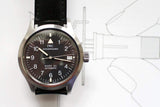 IWC Mark XII men's pilot watch with black dial and leather strap, close-up front view