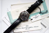 Men’s luxury IWC pilot watch with black leather strap, box, papers, and original documents