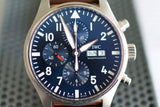 Close-up of a blue dial chronograph luxury Swiss watch with date and day display