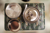 Swiss chronograph watch movement with case back removed, displaying intricate mechanics