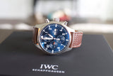 Luxury chronograph watch with blue dial, brown leather strap on black box