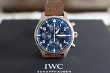Luxury IWC chronograph watch with blue dial and brown leather strap, close-up view
