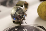 Pre-owned IWC Pilot Chronograph 3706 with black dial, steel case, and green leather strap
