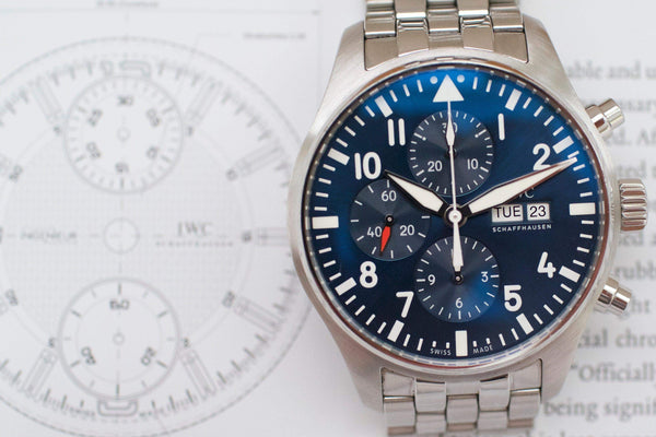 Luxury Swiss chronograph watch with blue dial, stainless steel bracelet, and subdials