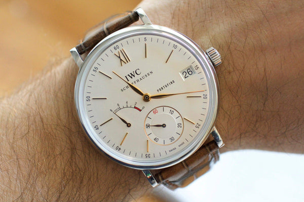 IWC Portofino 8 Days luxury Swiss watch with brown leather strap on wrist