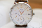 Close-up of IWC Portofino 8 Days luxury Swiss watch with white dial and leather strap