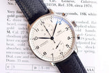 IWC Schaffhausen automatic chronograph watch with white dial and blue leather strap.