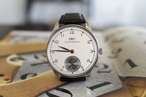 IWC Portuguese hand-wound luxury watch with white dial and black leather strap