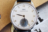 IWC Schaffhausen Portuguese hand-wound Swiss luxury watch with white dial and black leather strap