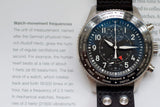 Luxury IWC pilot's chronograph watch with black dial and world time bezel on a leather strap