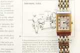 Jaeger-LeCoultre Reverso luxury watch with gold and steel bracelet resting on a technical diagram.