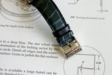 Luxury watch leather strap with silver buckle on technical drawing background
