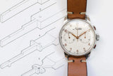 Vintage Minerva chronograph watch with brown leather strap on technical drawings