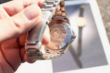 Close-up of the case back and stainless steel bracelet of a luxury Swiss watch